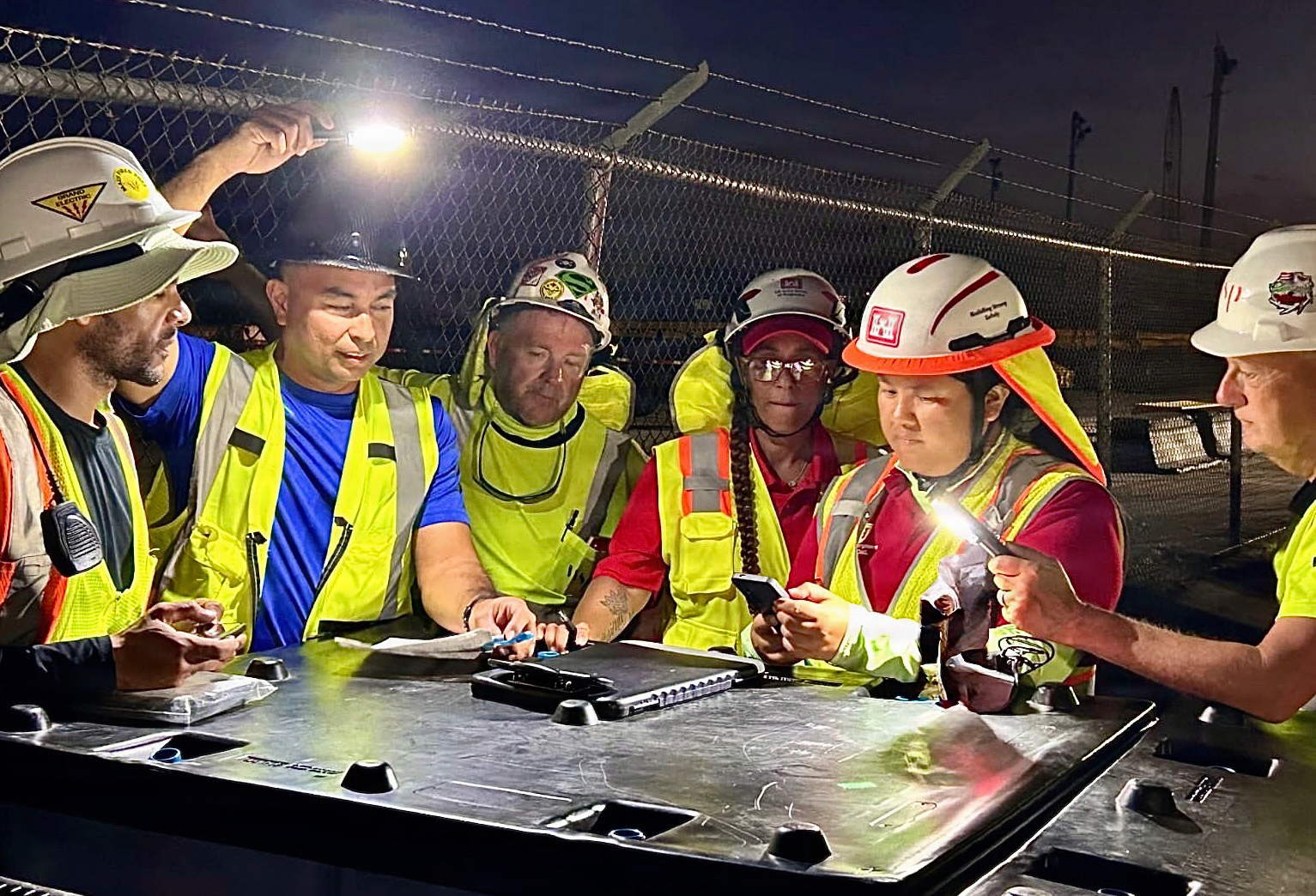 Members of the U.S. Army Corps of Engineers (USACE) Honolulu District’s Power Planning and Response Team a work with their contractors in the late night hours to install temporary emergency power to critical facilities throughout Saipan in the wake of Super Typhoon Sinlaku.