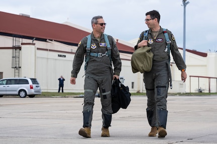 CSAF and 416th director of operations walking on the flightline.