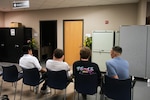 Military applicants wait to be sent to their next evaluation at Chicago MEPS. USMEPCOM's new Conditions Unlikely to be Waived (CUW) policy will focus evaluations on applicants more likely to qualify for service.