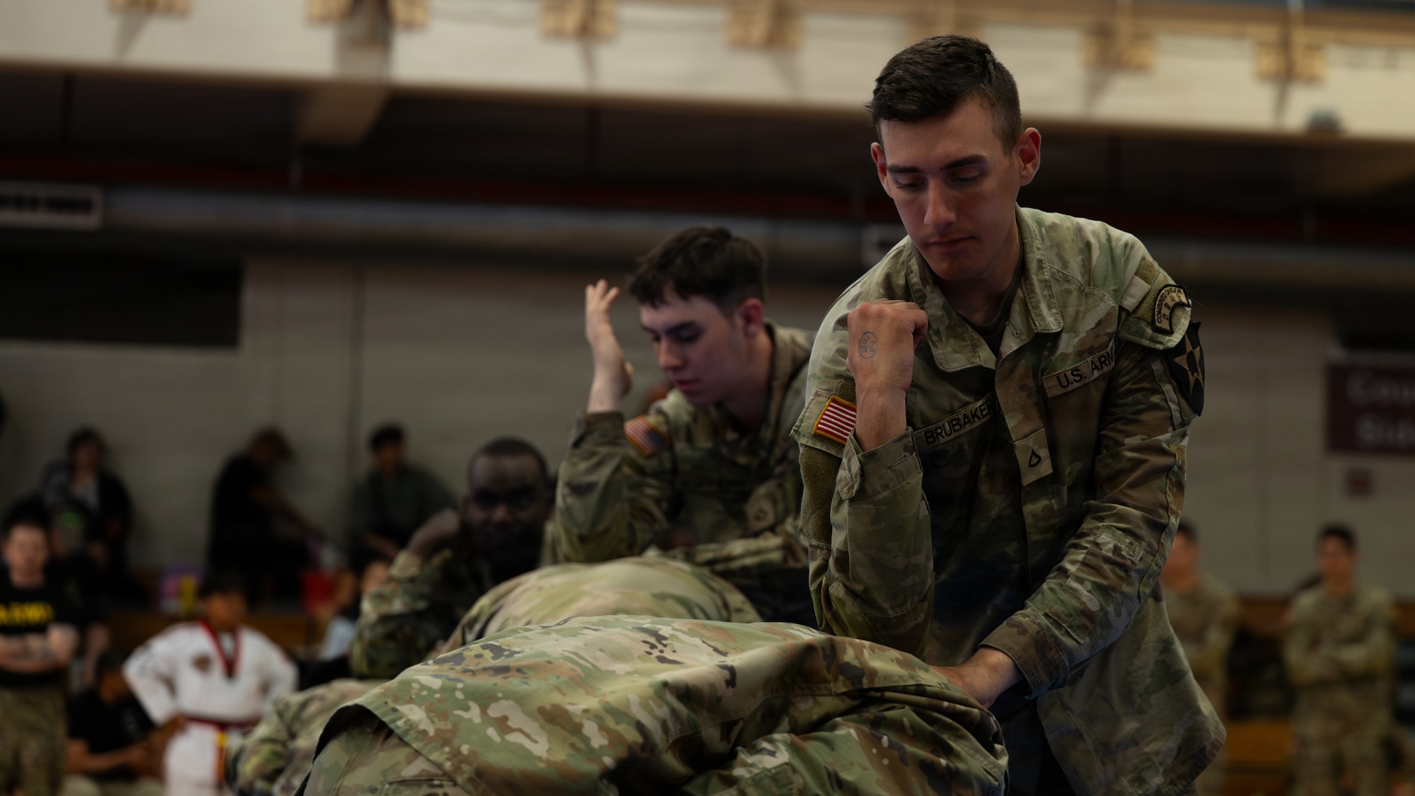 A U.S. Soldier spars with a teammate during the 5th Annual Republic of Korea-U.S. Friendship Children & Family Taekwondo Exhibition Festival at Osan Air Base, ROK, May 2, 2026.