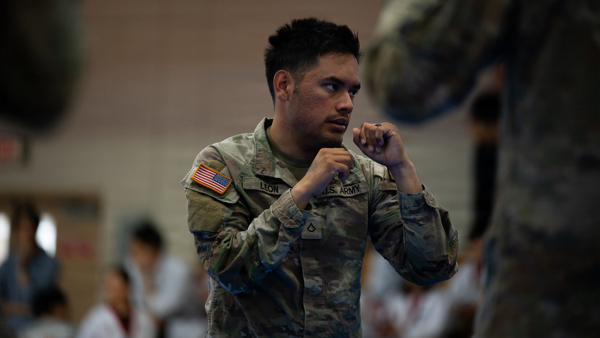 A U.S. Soldier spars with a teammate during the 5th Annual Republic of Korea-U.S. Children Friendship Taekwondo Exhibition Festival at Osan Air Base, ROK, May 2, 2026.