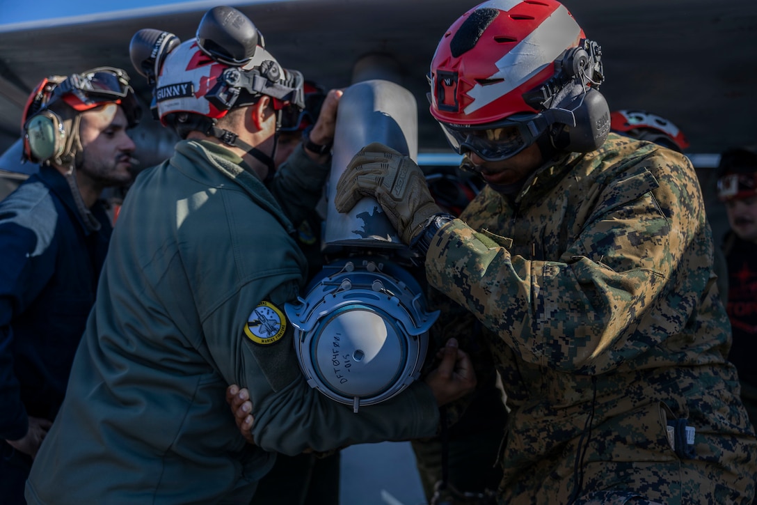 U.S. service members load ordnance onto an F/A-18E Super Hornet during exercise Red Flag-Alaska 26-1 at Eielson Air Force Base, Alaska, April 29, 2026.Red Flag-Alaska is a Pacific Air Forces-led exercise designed to simulate complex scenarios in a realistic training environment, providing unique opportunities to integrate joint and coalition forces into multilateral training, enhancing our ability to respond to contingencies in the region. (U.S. Marine Corps photo by Lance Cpl. Bryan Giraldo)