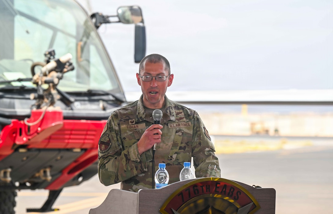 U.S. Air Force Lt. Col Geoffrey Cohan addresses the servicemembers and attendees for the first time as the 776th Expeditionary Air Base Squadron Commander during a change of command ceremony at Chabelley Airfield, Djibouti, April 24, 2026.  The 776th EABS supports the 449th Air Expeditionary Group through combined operations and initiatives aimed at advancing strategy-aligned priorities. (U.S. Army photo by SGT Vivian Nakaana)