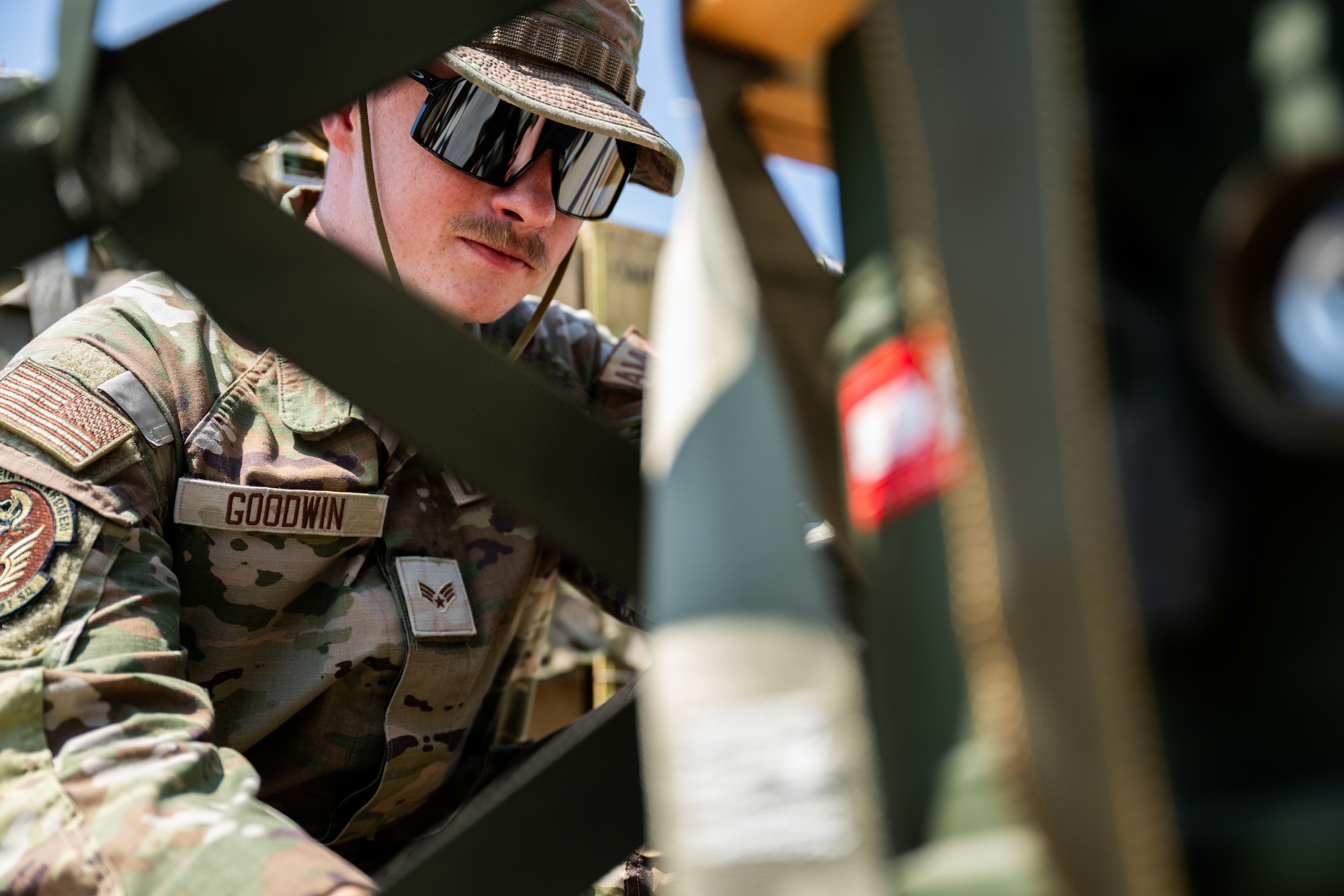 Airman looks at pallets