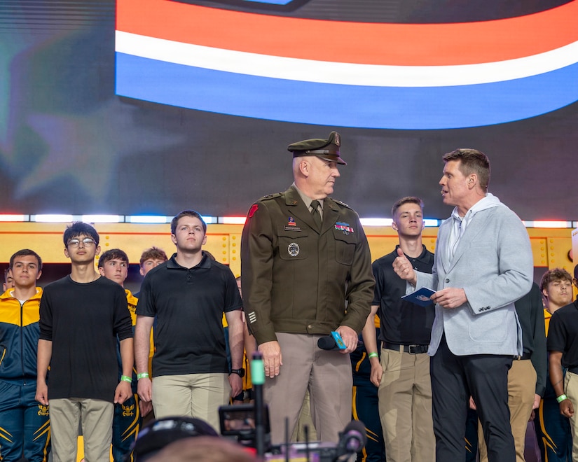 Future Soldiers and Airmen stand on stage during a multi-service enlistment ceremony at the NFL Draft at Acrisure Stadium, April 25, 2026. Approximately 180 individuals took the oath of enlistment, marking the start of their service to the commonwealth and the nation. (U.S. Air National Guard photo by Tech. Sgt. Zoe M. Wockenfuss)