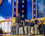 Future Soldiers and Airmen stand on stage during a multi-service enlistment ceremony at the NFL Draft at Acrisure Stadium, April 25, 2026. Approximately 180 individuals took the oath of enlistment, marking the start of their service to the commonwealth and the nation. (U.S. Air National Guard photo by Tech. Sgt. Zoe M. Wockenfuss)