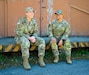 Lt. Col. Pennie Llorente, Reserve Component Affairs Officer in Charge, and Capt. Lizette Sierra, an operations officer with team Sentinel, share their experiences at the Joint Multinational Readiness Center, Hohenfels Training Area, Hohenfels, Germany, May 2, 2026. Sentinel Team is the critical linchpin connecting JMRC to the enablers it desperately needs. They are the primary orchestrators for compo 2/3 forces from the National Guard and Army Reserve, without which, the training mission would face critical shortfalls. JMRC's Combat Training Center rotations like Combined Resolve drive unrivaled innovation and readiness in the U.S. Army Europe and Africa area of operations. (U.S. Army Reserve photo by U.S. Army Lt. Col. Olha Vandergriff.)