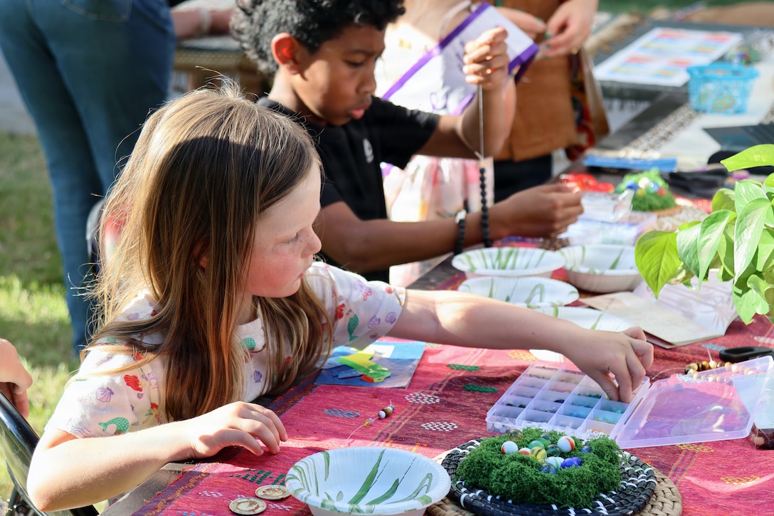 Marines, and families attend a spring festival by MCCS aboard Marine Corps Logistics Base Barstow, California on May 1st. The “Around the World” themed event featured cultural booths, live entertainments including a mariachi band, a DJ, Brazilian dancer, food and prize activities for children, showcasing diverse cultures within the community
