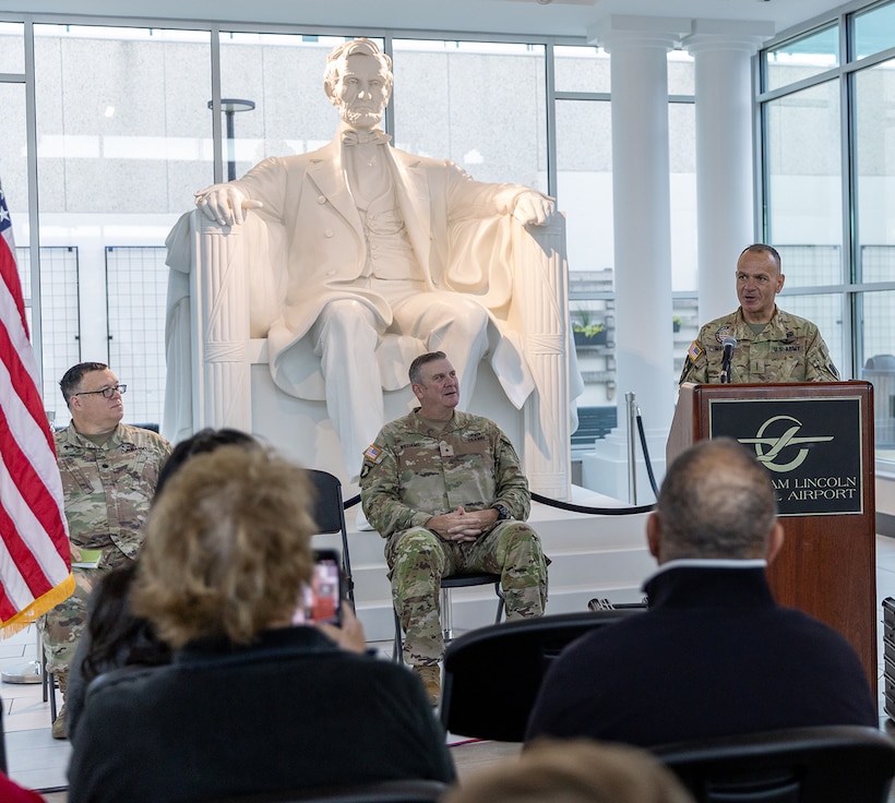 Chief Warrant Officer 5 Michael Maroon, Commander of Detachment 5, Company A, 2nd Battalion, 245th Aviation Regiment, addresses Detachment Soldiers, family members, and friends, during the unit’s mobilization ceremony May 4 at the Abraham Lincoln Capital Airport in Springfield.