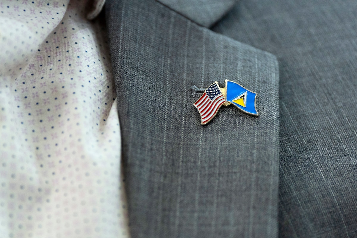 A U.S. and Saint Lucia flag lapel pin is worn during an opening ceremony for the Lesser Antilles Medical Assistance Team (LAMAT) 2026 mission at the Millennium Heights Medical Complex in Castries, Saint Lucia, April 27, 2026. LAMAT reinforces regional cooperation by bringing together U.S. and partner-nation medical teams to address shared healthcare challenges while strengthening enduring relationships across the Caribbean. (U.S. Air force photo by Tech. Sgt. Rachel Maxwell)