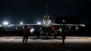 Members of the Colorado Air National Guard prepare an F-16C Fighting Falon for a flight during night flying operations at Kadena Air Base, Japan, April 14, 2026. The COANG is participating in a mass joint exercise that involves multiple combined operations and branches of the U.S. military throughout the Indo-Pacific area of responsibility. (U.S. Air National Guard photo by Staff Sgt. Lucarrio Lovato)