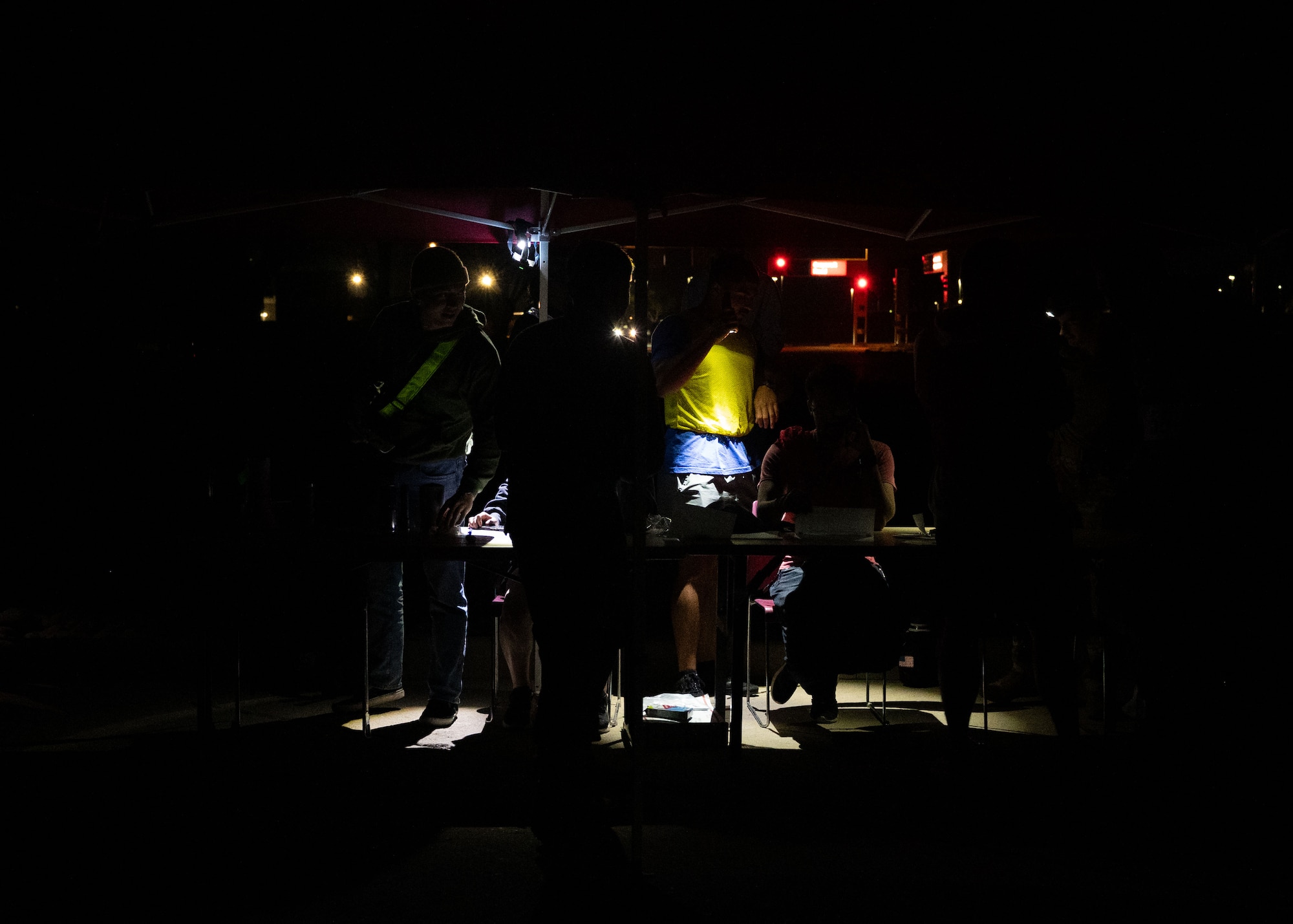Volunteers help participants weigh their bags prior to the first Norwegian Foot March at Davis-Monthan Air Force Base, Arizona, May 2, 2026. U.S. Airmen who participated in the march were required to use a rucksack with a weight of no less than 25 pounds at the start and upon completion of the race. (U.S. Air Force photo by Airman Najzee Kuzu)