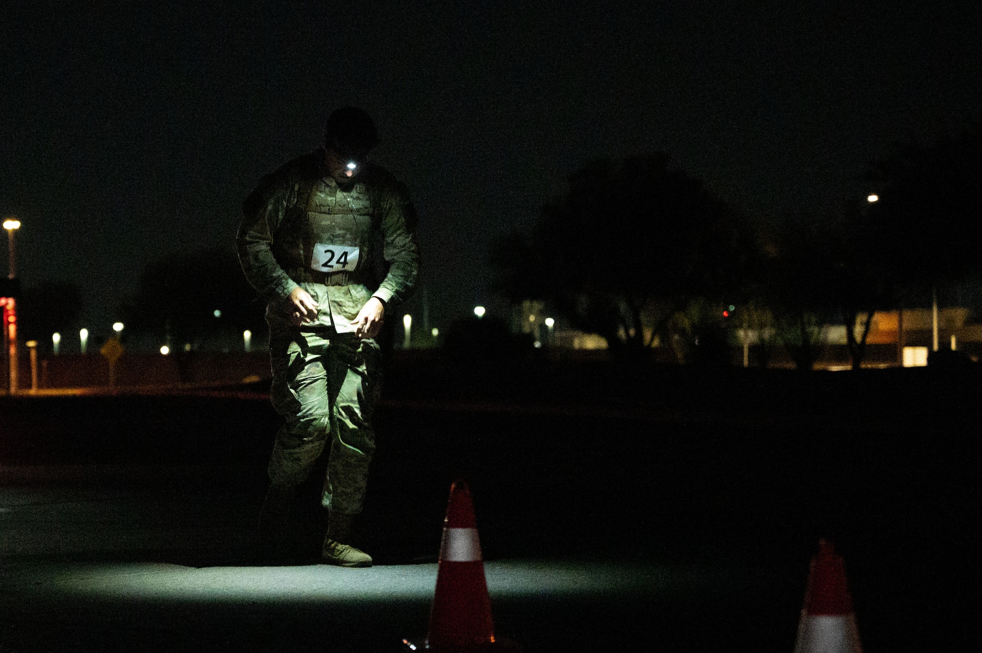 A U.S. Air Force Airman assigned to the 355th Wing passes an aid station during the Norwegian Foot March on Davis-Monthan Air Force Base, Arizona, May 2, 2026. The Norwegian Foot March is a way to strengthen Airmen’s mission readiness and physical fitness. (U.S. Air Force photo by Airman Najzee Kuzu)