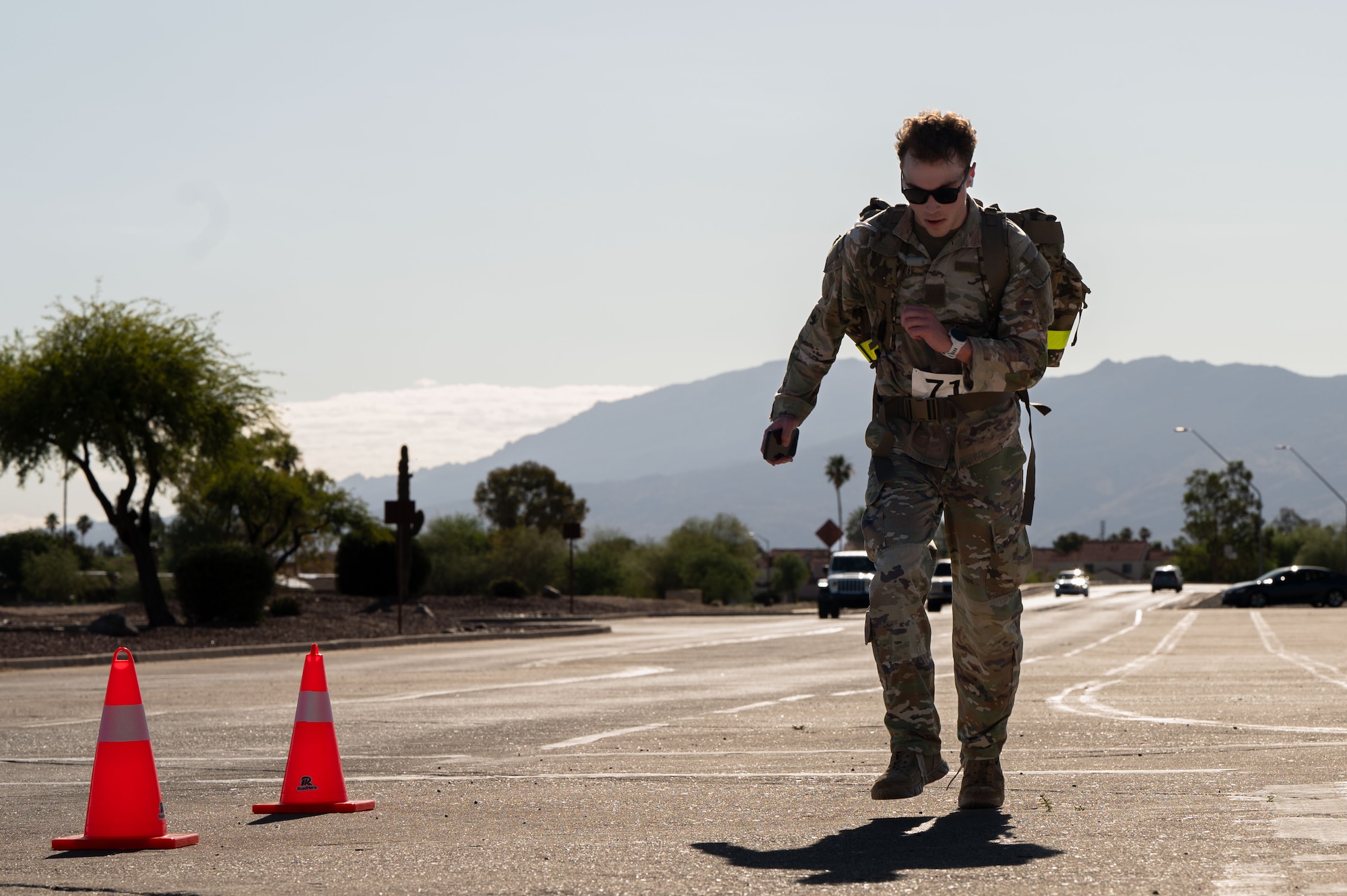 A U.S. Air Force Airman crosses the finish line of the Norwegian Foot March held at Davis-Monthan Air Force Base, Arizona, May 2, 2026. The Norwegian Foot March is one way to keep Airmen ready for any mission requirement, while also promoting esprit de corps within the community. (U.S. Air Force photo by Airman Najzee Kuzu)