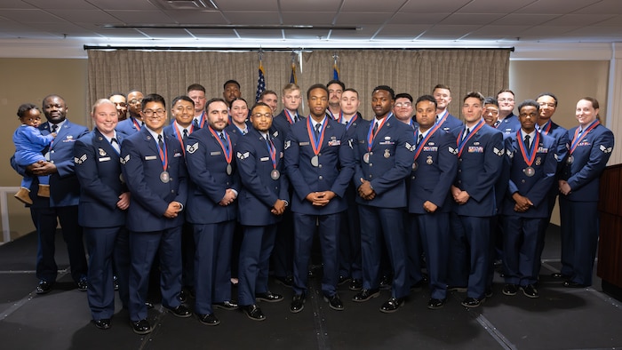 Service members standing together for group photo
