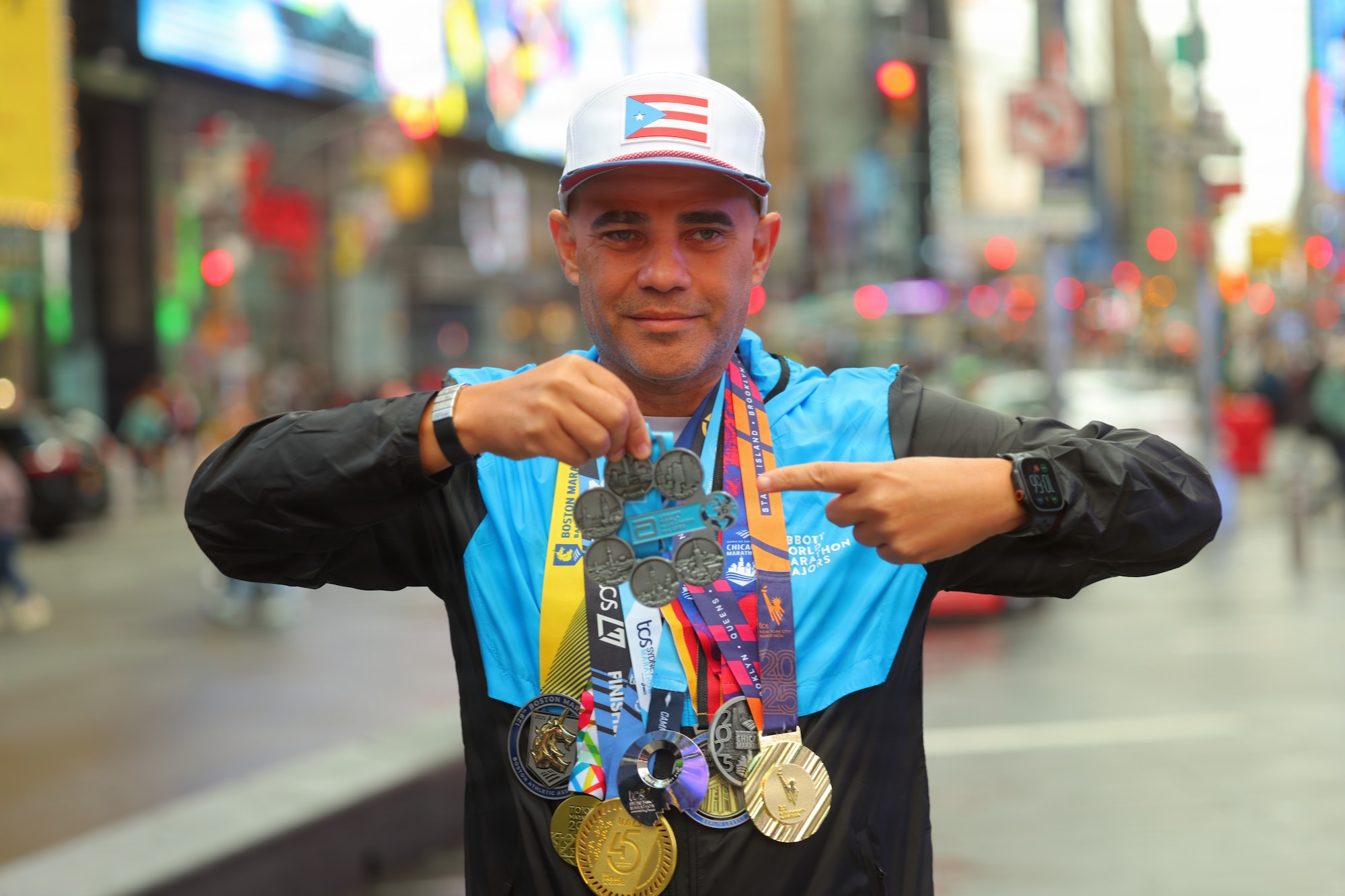 U.S. Air Force Col. Alfredo “Juny” Laboy poses with his World Marathon Majors medals in Times Square, New York City, Nov. 2, 2025. Laboy became the first active-duty service member to complete all seven World Marathon Majors within a single calendar year. (Courtesy Photo)
