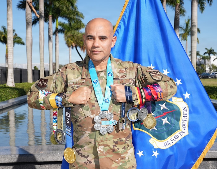 U.S. Air Force Col. Alfredo “Juny” Laboy poses with his World Marathon Majors medals outside U.S. Southern Command headquarters in Miami, Feb. 24, 2026. Laboy became the first active-duty service member to complete all seven World Marathon Majors within a single calendar year, marking a rare endurance achievement across the global race series. (Courtesy photo)