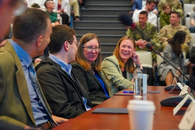 Participants of the Deterrence and Escalation Game and Review (DEGRE) wargame discuss lessons learned onboard Naval Station Newport, April 17, 2026.