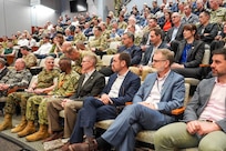 Participants of the Deterrence and Escalation Game and Review (DEGRE) wargame observe game discussions onboard Naval Station Newport, April 17, 2026.