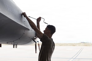 U.S. Air Force Senior Airman Bradley Cannon, 8th Aircraft Maintenance Unit avionics journeyman, opens a panel on an F-16 Fighting Falcon at Holloman Air Force Base, New Mexico, April 6, 2026.