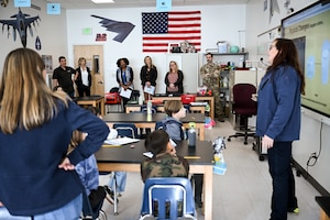 (Center, from left) Natalie Hawkins, spouse of Lt. Gen. Stacey Hawkins, Air Force Sustainment Center commander, Dr. Becky Andrle, spouse of Col. Craig Andrle, 388th Fighter Wing commander, and Tammy Holland, spouse of Col. Jeffrey Holland, 75th Air Base Wing commander, visit a Starbase classroom during a tour of Hill Air Force Base, Utah, Nov. 15, 2022. (U.S. Air Force photo by R. Nial Bradshaw)