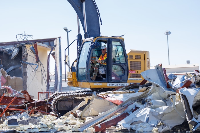 Col. Bradly Bucholz, 412th Civil Engineer Group commander, demolishes Building 1400 on Edwards Air Force Base, California, Aug. 8, 2025. The demolition of the old building paved the way for construction of the new Flight Test Engineering Laboratory. (Air Force photo by CJ Raterman)