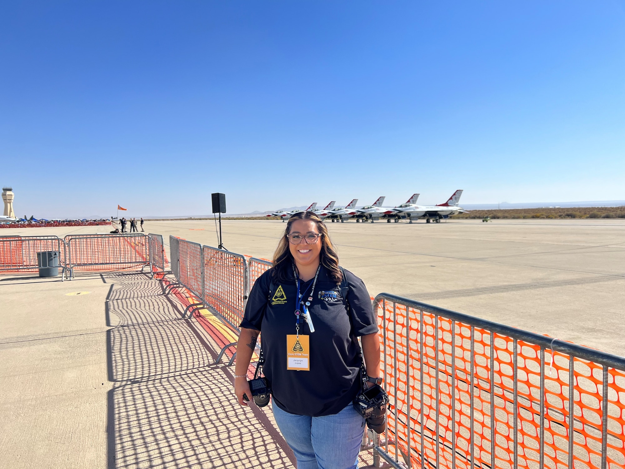 Jacqulyn Lopez, Air Force Test Center executive administrator, smiles while volunteering during the Aerospace Valley Air Show at Edwards Air Force Base Oct. 18-19, 2025. Photography is a way for Lopez to distress, especially when she is able to use her photography skills to support the local Edwards AFB community through aviation.  (Courtesy photo)