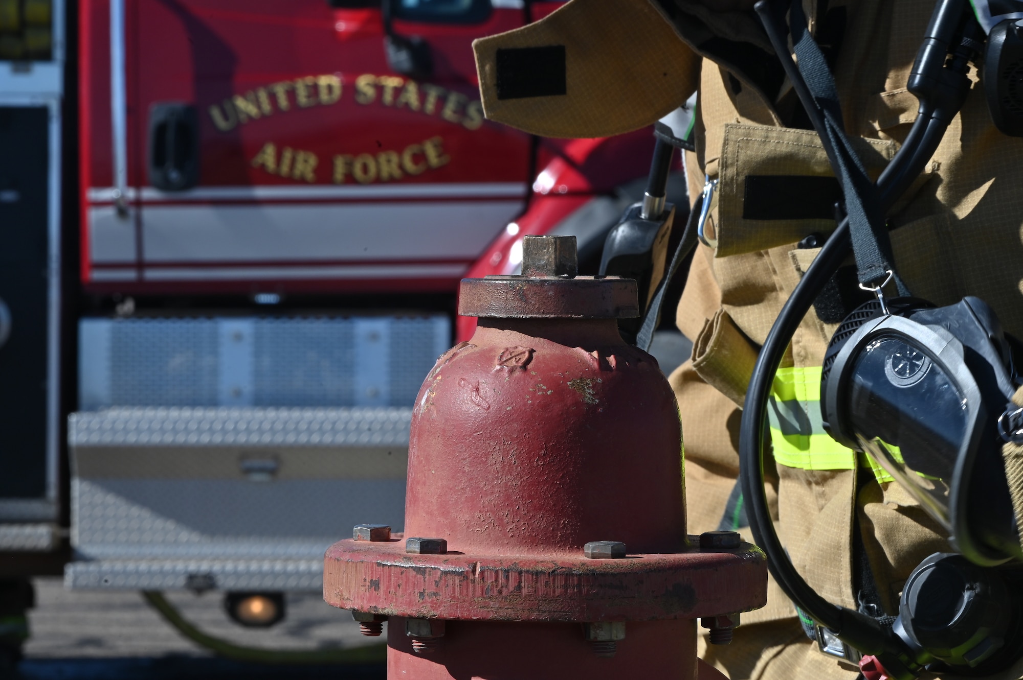 Ronald Smith, 377th Civil Engineer Squadron fire protection specialist, prepares to open a fire hydrant to insert a hose as part of a Kirtland Air Force Base Fire and Emergency Services (KFES) exercise.