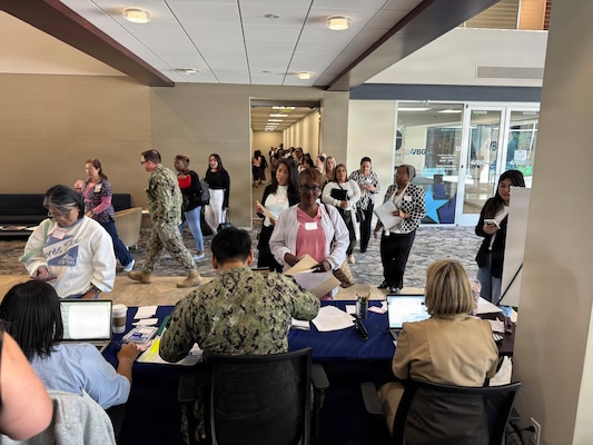 SAN DIEGO (April 29, 2026) – Healthcare professionals check in at a Naval Medical Center San Diego (NMCSD) civilian hiring event held at Laurus College. The hiring fair, which drew nearly 300 attendees, was designed to fill critical civil service vacancies and extended over 20 on-the-spot tentative job offers to qualified candidates. The mission of NMCSD is to optimize health and enhance readiness. NMCSD employs more than 5,500 active-duty military personnel, civilians, and contractors in southern California to deliver exceptional care afloat and ashore. (U.S. Navy photo contributed)