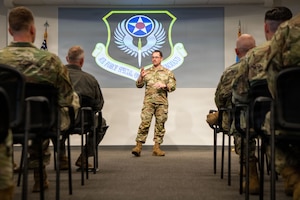 Special Operations Communications Squadron director of operations, addresses graduates and distinguished guests at an Air Force Special Operations Command Tactical Communicator Course.