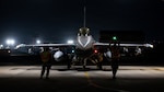 Members of the Colorado Air National Guard prepare an F-16C Fighting Falon for a flight during night flying operations at Kadena Air Base, Japan, April 14, 2026. The COANG is participating in a mass joint exercise that involves multiple combined operations and branches of the U.S. military throughout the Indo-Pacific area of responsibility. (U.S. Air National Guard photo by Staff Sgt. Lucarrio Lovato)
