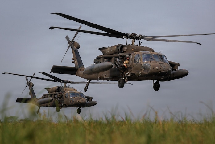 U.S. Army UH-60 Black Hawk helicopters assigned to Task Force Saber, 25th Combat Aviation Brigade take off during a long-range maritime air assault operation as part of Exercise Balikatan 2026 at Cagayan North International Airport, La-lo, Philippines, April 23, 2026.