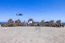 Multinational partners pose for a photo after a counter-landing live-fire exercise as part of Exercise Balikatan 2026 at La Paz Sand Dunes, Laoag City, Philippines, May 4, 2026.