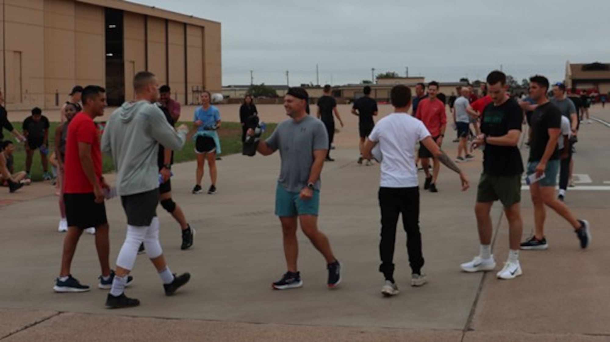 Airmen celebrate after finishing a 5k run