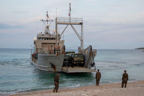 U.S. Marines with 3rd Littoral Combat Team, 3rd Marine Littoral Regiment, 3rd Marine Division, watch as a U.S. Army Landing Craft Utility assigned to 7th Infantry Division, Multi-Domain Command - Pacific, approaches the shore for a ship-to-shore movement during Exercise Balikatan 2026 in Calayan, Cagayan, Philippines, April 28, 2026.