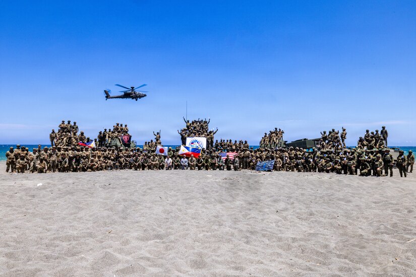 Multinational partners pose for a photo after a counter-landing live-fire exercise as part of Exercise Balikatan 2026 at La Paz Sand Dunes, Laoag City, Philippines, May 4, 2026.