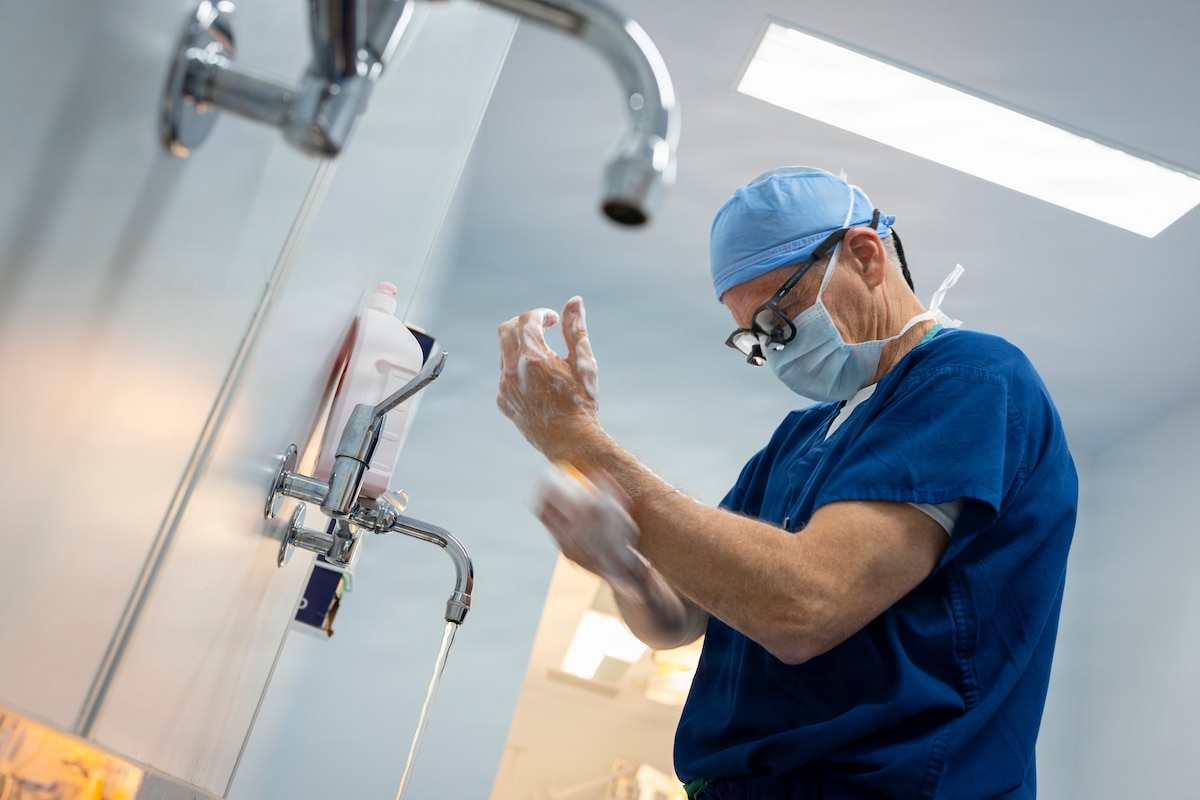 Image of an Airman washing his hands.