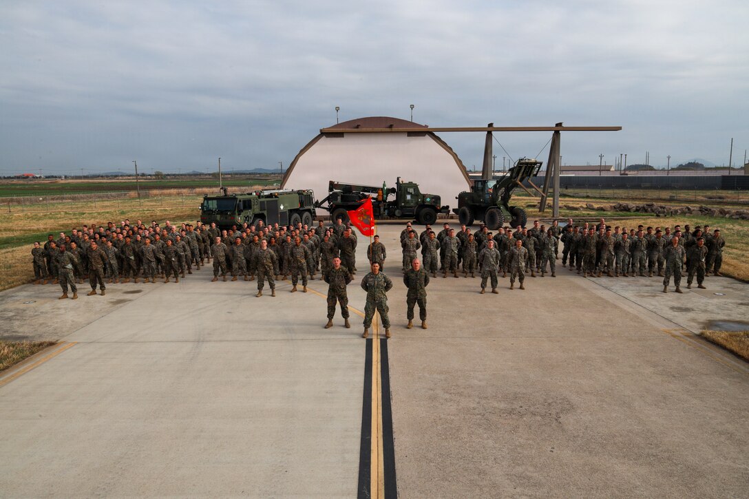 U.S. service members with Marine Wing Support Squadron (MWSS) 174, Marine Aircraft Group 24, 1st Marine Aircraft Wing, pose for a squadron photo on Kunsan Air Base, Jeollabuk-do, South Korea, April 5, 2026.