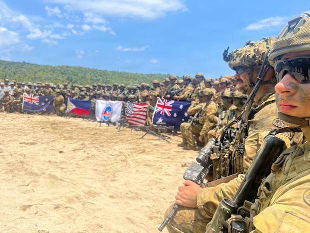 Service members from New Zealand Army, Armed Forces of the Philippines, U.S. Marine Corps and Australian Defence Force pose for a photo following a counter-landing live-fire exercise during Exercise Balikatan 2026 in Palawan, Philippines, April 27, 2026