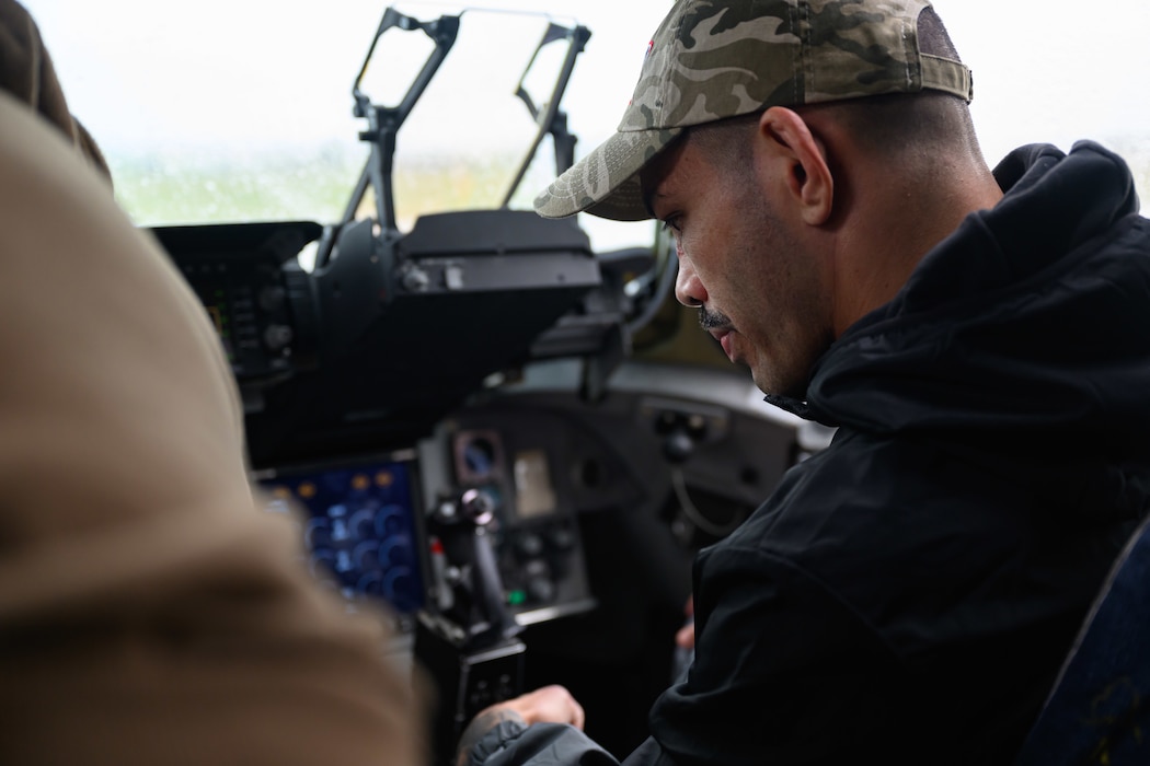 A person is shown the cockpit of a cargo aircraft.