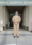 Lt. Jacob King, a pharmacist at U.S. Naval Hospital Guam, poses for a photo in front of the hospital. King was selected as the Navy Pharmacy Junior Officer of the Year for fiscal year 2025 by the U.S. Navy Bureau of Medicine and Surgery. The award recognizes his exceptional leadership, clinical expertise, and profound impact on pharmacy operations and patient care across the Indo-Pacific region and beyond.