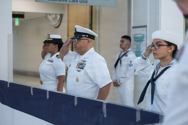 AGANA HEIGHTS (March 27, 2026) – Command Master Chief Miguel Lugo and Sailors man the rails at the U.S. Navy Medicine Readiness and Training Command (USNMRTC) Guam change of command ceremony, March 27. The ceremony also marked the transfer of authority for U.S. Naval Hospital Guam.
