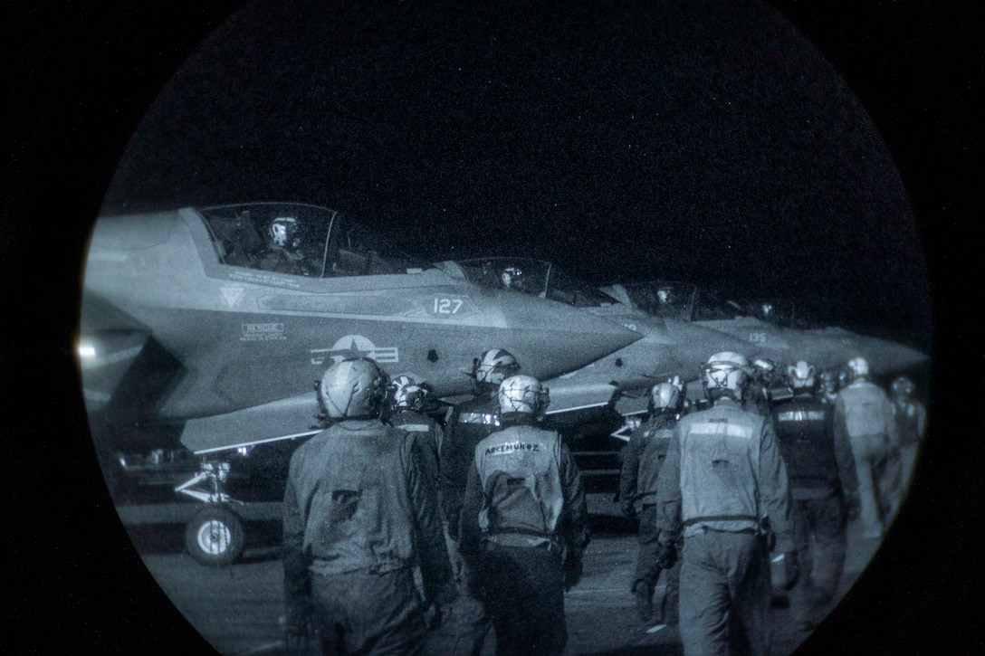 U.S. Marines with Marine Fighter Attack Squadron (VMFA) 122, 11th Marine Expeditionary Unit, prepare F-35B Lightning II for flight operations aboard Wasp-class amphibious assault ship USS Boxer (LHD 4) in the Pacific Ocean, March 21, 2026. The 11th MEU is currently underway aboard the Boxer Amphibious Ready Group in the U.S. 3rd Fleet area of operations demonstrating the United States’ long-term commitment to a free and open Indo-Pacific.