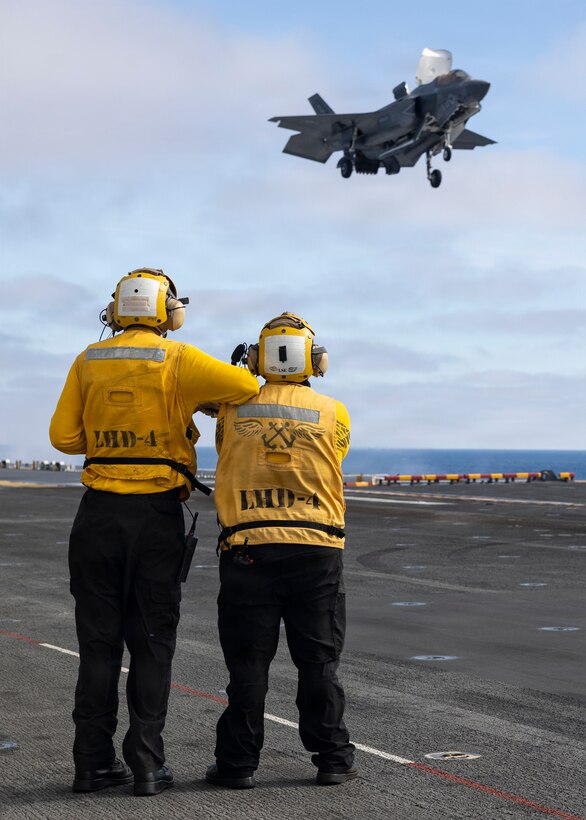 U.S. Sailors assigned to Wasp-class amphibious assault ship USS Boxer (LHD 4), oversee the landing of a U.S. Marine Corps F-35B Lightning II attached to Marine Fighter Attack Squadron (VMFA) 122, 11th Marine Expeditionary Unit during flight operations in the Pacific Ocean, March 21, 2026. The 11th MEU is currently underway aboard the Boxer Amphibious Ready Group in the U.S. 3rd Fleet area of operations demonstrating the United States’ long-term commitment to a free and open Indo-Pacific.