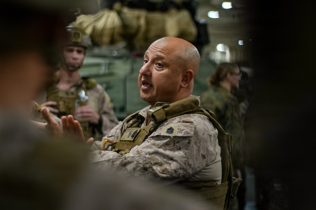 U.S. Marine Corps Gunnery Sgt. Yezid Beltranrodriguez, a motor transport chief with Echo Battery, Battalion Landing Team 3/5, 11th Marine Expeditionary Unit, teaches a class on motor transport convoy safety aboard San Antonio-class amphibious transport dock ship USS Portland (LPD 27) in the Pacific Ocean, Mar 23, 2026. The 11th MEU is currently underway aboard the Boxer Amphibious Ready Group in the U.S. 3rd Fleet area of operations demonstrating the United States’ long-term commitment to a free and open Indo-Pacific.