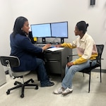 Army Lt. Col. Angela Nolen, physician assistant, reviews documentation with an applicant during the Capacity Augmentation Team proof of concept at New York MEPS, Feb. 28. USMEPCOM's first full Capacity Augmentation Team initiative took place Apr. 28-30, achieving a 70% increase in maximum daily capacity/allocation.