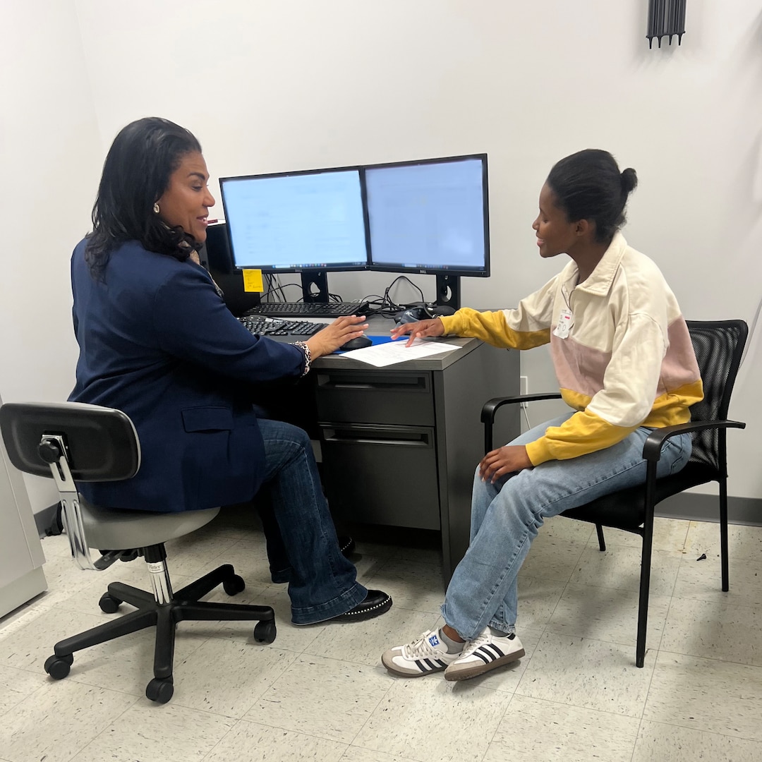Army Lt. Col. Angela Nolen, physician assistant, reviews documentation with an applicant during the Capacity Augmentation Team proof of concept at New York MEPS, Feb. 28. USMEPCOM's first full Capacity Augmentation Team initiative took place Apr. 28-30, achieving a 70% increase in maximum daily capacity/allocation.