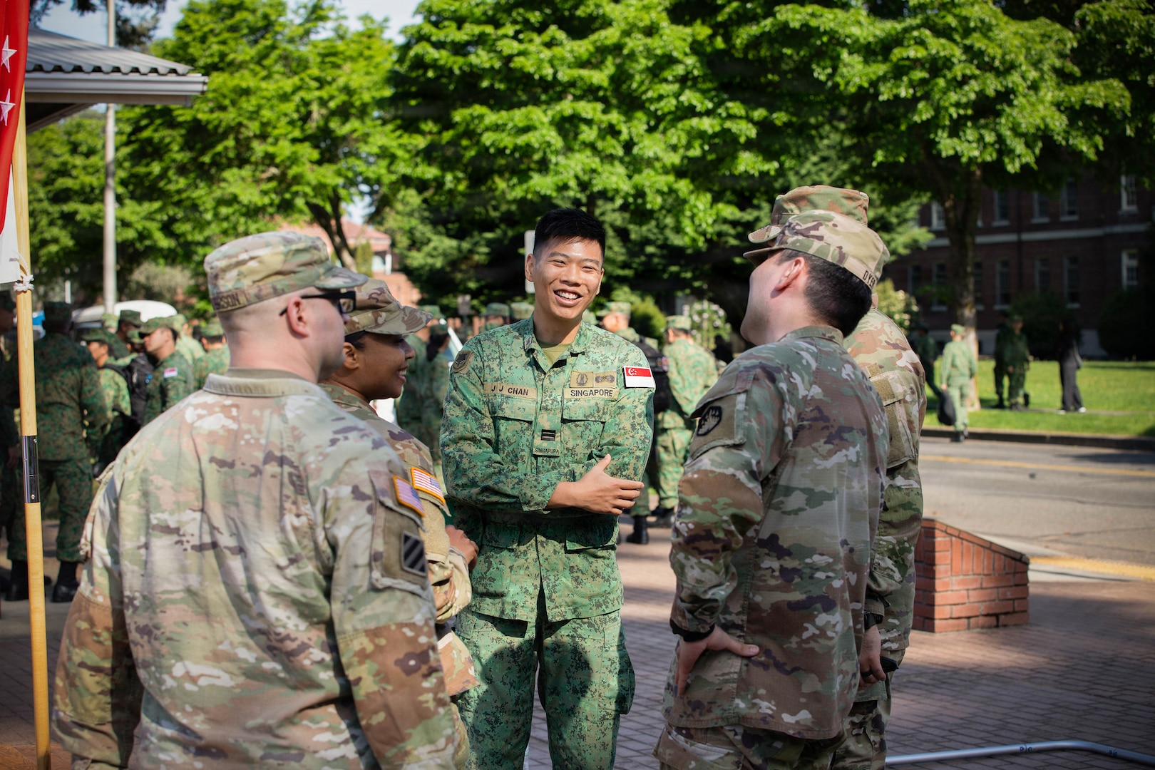 U.S. Soldiers with the Washington National Guard build relationships with their Singaporean counterparts after concluding the opening ceremony for Exercise Tiger Balm 2026 at Joint Base Lewis-McChord, Washington, May 4, 2026.