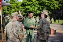 U.S. Soldiers with the Washington National Guard build relationships with their Singaporean counterparts after concluding the opening ceremony for Exercise Tiger Balm 2026 at Joint Base Lewis-McChord, Washington, May 4, 2026.