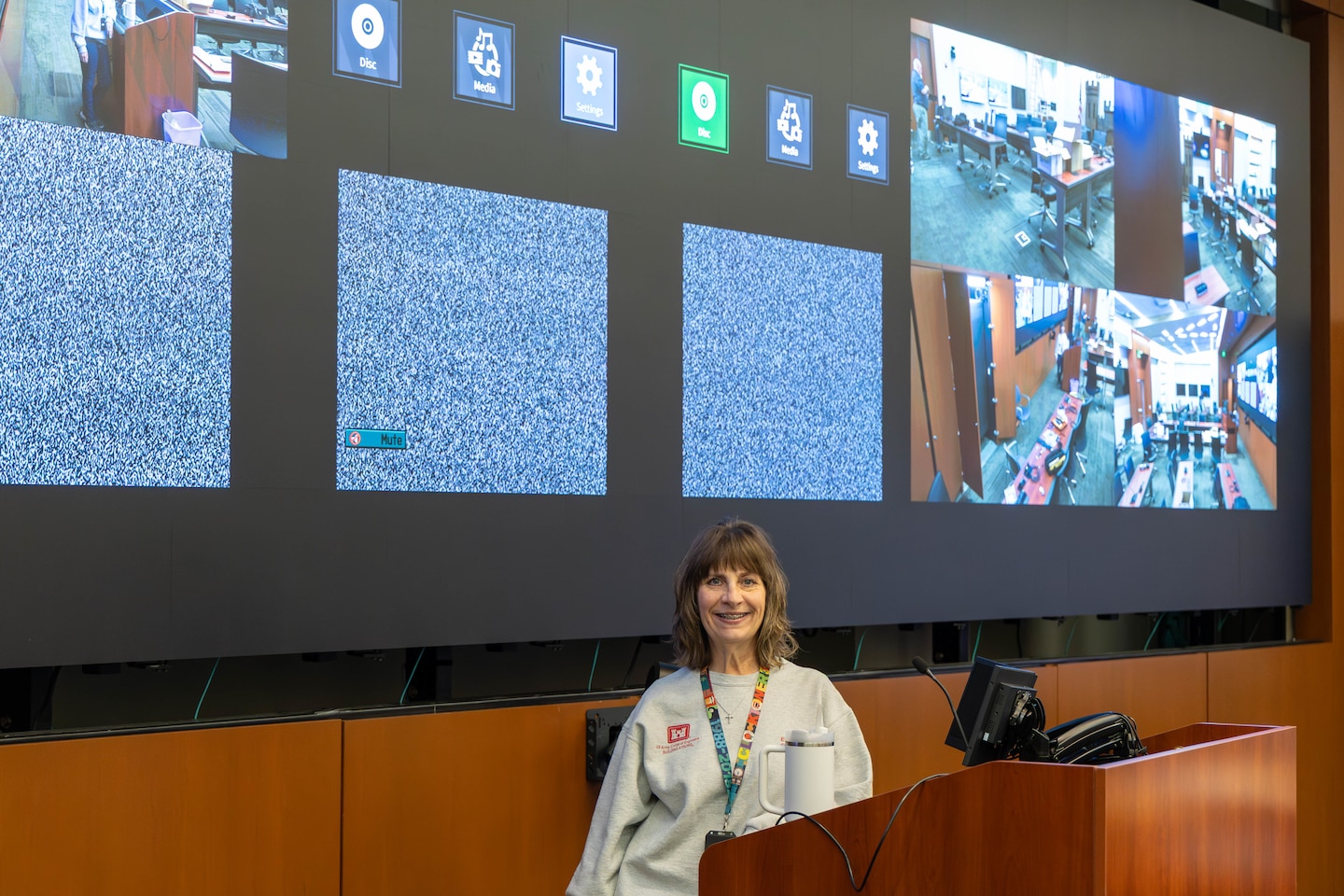 Woman standing in front of newly installed screen wall.